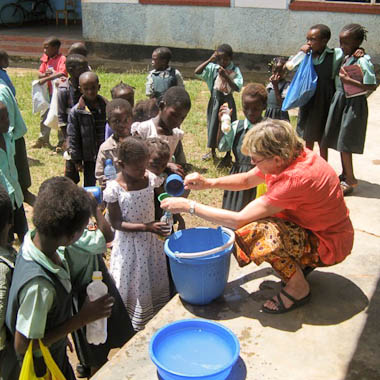Alison Raymond dispensing children&rsquo;s milk